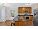 Eat-in kitchen with stainless steel appliances, a gas range, and a breakfast bar at 1438 N Crossing Ne Dr, Atlanta, GA 30329
