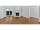 Hardwood floor living room features a fireplace and sliding glass doors to the outside at 1438 N Crossing Ne Dr, Atlanta, GA 30329