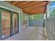 View of patio featuring sliding door access to a fenced in area with a covered ceiling at 1438 N Crossing Ne Dr, Atlanta, GA 30329