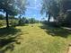 Large backyard offers an expansive grassy lawn shaded by mature trees, creating a private outdoor retreat at 2678 Stardust Trl, Decatur, GA 30034