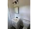 Bright bathroom featuring a sleek white vanity, modern lighting, and neutral accents at 2678 Stardust Trl, Decatur, GA 30034