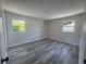 Spacious bedroom featuring two windows, new floors, and fresh paint at 2678 Stardust Trl, Decatur, GA 30034