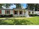 Charming white brick home with well-kept lawn, complemented by classic shutters and green landscaping at 2678 Stardust Trl, Decatur, GA 30034