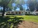 Classic white brick home with dark trim, complemented by natural wood shutters and a bright green lawn at 2678 Stardust Trl, Decatur, GA 30034
