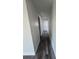 Hallway featuring wood floors, fresh paint, and access to various rooms at 2678 Stardust Trl, Decatur, GA 30034
