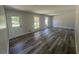 Bright living room featuring new floors, fresh paint, and natural light from the windows at 2678 Stardust Trl, Decatur, GA 30034