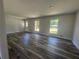 Spacious living room boasts new floors, fresh paint, and natural light from many windows at 2678 Stardust Trl, Decatur, GA 30034
