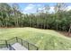 Large backyard featuring level lot with newly installed sod and surrounding mature trees at 2843 N North Bogan Rd, Buford, GA 30519