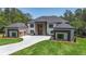 Stunning two-story home featuring a symmetrical design and large front yard with a long private driveway at 2843 N North Bogan Rd, Buford, GA 30519