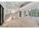 Open-concept living space boasts hardwood floors, high ceilings, staircase, and ample natural light at 2843 N North Bogan Rd, Buford, GA 30519