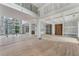 Spacious living room with hardwood floors, tall ceilings, and large windows offering natural light at 2843 N North Bogan Rd, Buford, GA 30519