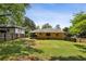 Spacious backyard with a wooden fence and a covered patio at 3314 Glenco Dr, Decatur, GA 30032