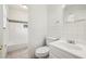 Clean, bright bathroom with a white tile, a vanity, a toilet, and a bathtub at 3314 Glenco Dr, Decatur, GA 30032