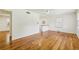 Bright living room features gleaming hardwood floors, fresh white paint, and natural light from large windows at 3314 Glenco Dr, Decatur, GA 30032