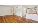 Open-concept living space with hardwood floors flowing into the adjacent kitchen and a view of the home's interior at 3314 Glenco Dr, Decatur, GA 30032