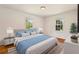 Bright bedroom with a large bed, natural light, hardwood floors, and neutral paint at 3314 Glenco Dr, Decatur, GA 30032