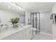 Modern bathroom with double vanity, marble shower, and stylish fixtures at 4723 N Springs Nw Rd, Kennesaw, GA 30144