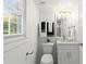Well-lit half bathroom featuring modern fixtures and natural light at 4723 N Springs Nw Rd, Kennesaw, GA 30144