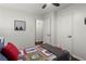 Cozy bedroom with hardwood floors and a sports-themed quilt at 4723 N Springs Nw Rd, Kennesaw, GA 30144