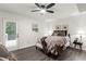 Bright bedroom with a ceiling fan, door to the deck, and neutral decor at 4723 N Springs Nw Rd, Kennesaw, GA 30144