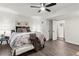 Spacious bedroom featuring a ceiling fan, ensuite bath, and hardwood floors at 4723 N Springs Nw Rd, Kennesaw, GA 30144