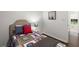Inviting bedroom features hardwood floors and a sports-themed blanket at 4723 N Springs Nw Rd, Kennesaw, GA 30144