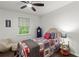 Decorated bedroom features hardwood floors, a window with a tree view, and modern decor at 4723 N Springs Nw Rd, Kennesaw, GA 30144