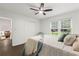Bedroom with hardwood floors, a ceiling fan, and a closet with window view at 4723 N Springs Nw Rd, Kennesaw, GA 30144