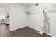 Walk-in closet with modern design, wire shelving, and wood-look flooring at 4723 N Springs Nw Rd, Kennesaw, GA 30144