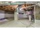 Clean and encapsulated crawlspace with white vapor barrier on walls and floor at 4723 N Springs Nw Rd, Kennesaw, GA 30144