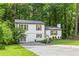 Charming two-story home with white siding, wood shutters, and a well-manicured front yard at 4723 N Springs Nw Rd, Kennesaw, GA 30144