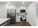 Modern kitchen with stainless steel appliances, white cabinets, and a convenient layout at 4723 N Springs Nw Rd, Kennesaw, GA 30144