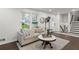 Bright living room featuring hardwood floors, stylish decor, and ample natural light at 4723 N Springs Nw Rd, Kennesaw, GA 30144