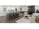 Open-concept living space featuring a modern kitchen, dining area, and cozy seating at 4723 N Springs Nw Rd, Kennesaw, GA 30144