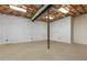 Unfinished basement with painted block walls, concrete floor, exposed insulation, and some lighting at 3441 Sherrod Sw Dr, Marietta, GA 30060