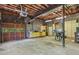 Spacious unfinished basement with exposed brick walls, concrete floor, and vintage cabinets at 3441 Sherrod Sw Dr, Marietta, GA 30060