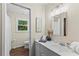 This bathroom features a window and sink with storage at 3441 Sherrod Sw Dr, Marietta, GA 30060