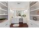 This bathroom features a vanity with dual mirrors and shelving at 3441 Sherrod Sw Dr, Marietta, GA 30060