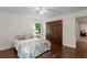 Bedroom featuring a double door closet and a window for natural lighting at 3441 Sherrod Sw Dr, Marietta, GA 30060
