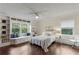 Bright bedroom with large window seat, built-in shelving, and ceiling fan at 3441 Sherrod Sw Dr, Marietta, GA 30060