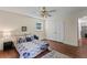 Well-lit bedroom with hardwood floors, a ceiling fan, and a closet at 3441 Sherrod Sw Dr, Marietta, GA 30060