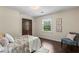 Comfortable bedroom featuring a double door closet, window, and a chair with a pillow for seating at 3441 Sherrod Sw Dr, Marietta, GA 30060