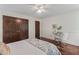 Bright bedroom featuring a vanity, double door closet, and hardwood floors at 3441 Sherrod Sw Dr, Marietta, GA 30060