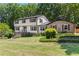 Charming two-story home with a combination of siding and brick exterior, and a beautifully landscaped front yard at 3441 Sherrod Sw Dr, Marietta, GA 30060