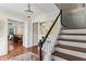 Inviting foyer boasts hardwood floors, a chandelier, and a view into the living room, highlighting the staircase at 3441 Sherrod Sw Dr, Marietta, GA 30060