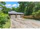 Detached two-car garage with a brick exterior and a cracked concrete driveway at 3441 Sherrod Sw Dr, Marietta, GA 30060