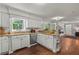 Spacious kitchen boasts granite counters, stainless steel appliances, and hardwood floors at 3441 Sherrod Sw Dr, Marietta, GA 30060