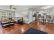 Spacious living area flows to kitchen and sunroom, featuring hardwood floors at 3441 Sherrod Sw Dr, Marietta, GA 30060