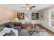 Spacious living room with hardwood floors, built-in bookshelves, and a comfortable sofa at 3441 Sherrod Sw Dr, Marietta, GA 30060