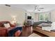 This spacious main bedroom features a TV, armchair and hardwood floors at 3441 Sherrod Sw Dr, Marietta, GA 30060